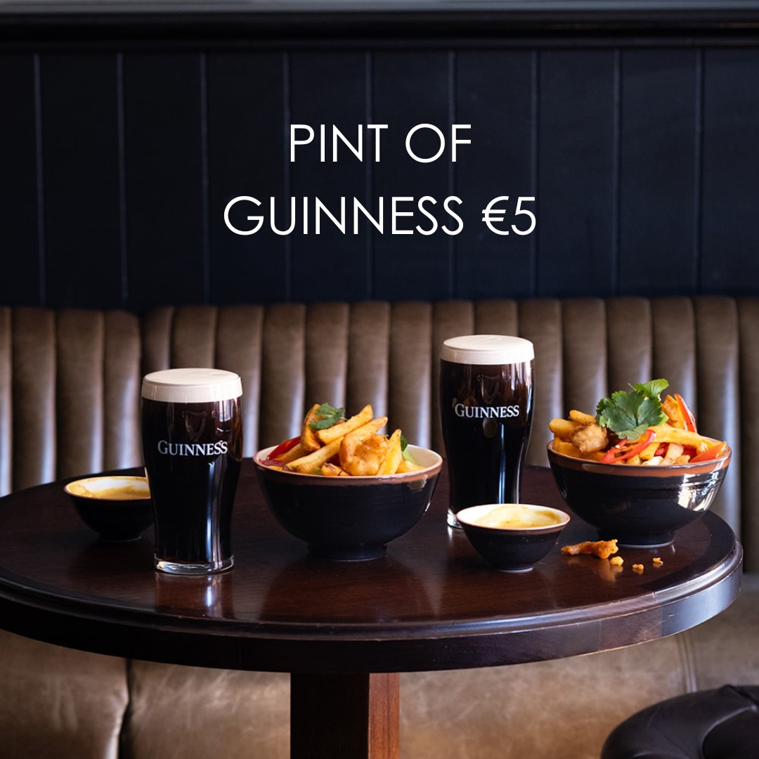 Pint of Guinness on a wooden table